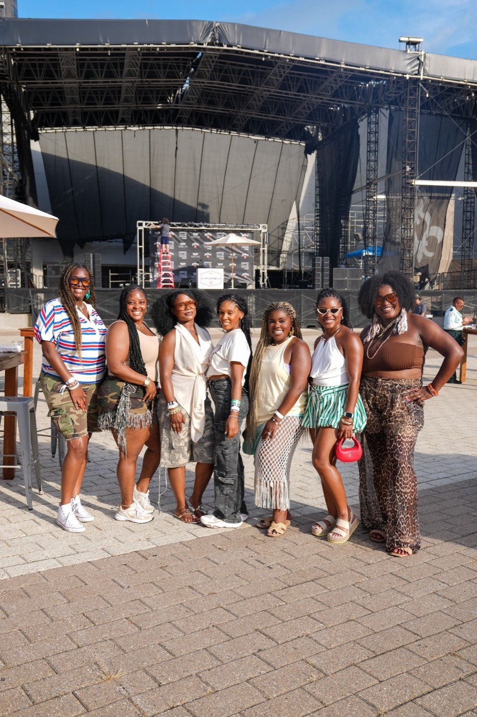 The 2026 group at a festival stage during Essence weekend in New Orleans
